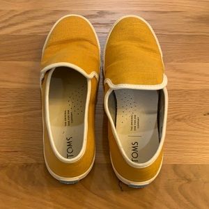 Mustard yellow TOMs slip on shoes